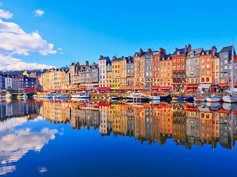 Honfleur's Vieux Bassin with its colourful houses reflected in the water